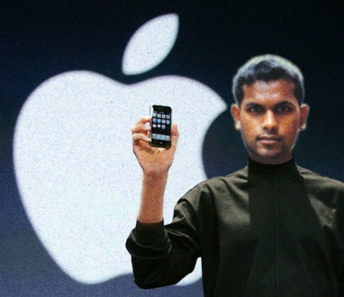 Prasith Govin photoshopped as Steve Jobs, in a black turtleneck holding an iPhone in front of the Apple logo at a keynote.